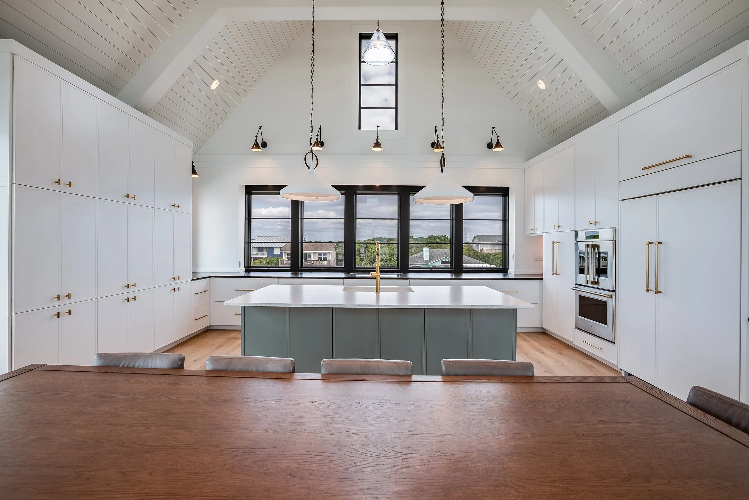 The dining table and kitchen at 6823 Ocean Drive, a setting for traditions to be made